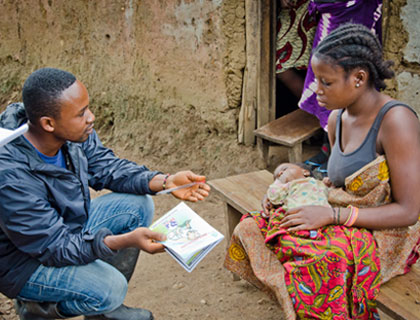 Woman with baby talking to man