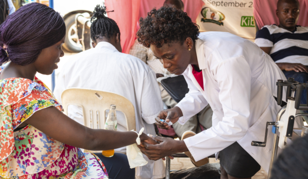 Kampala, Uganda - January 15th, 2020: Unidentified woman donates her blood in makeshift blood donation street point in Kampala, Uganda. Lack of donated blood is common in Kampala hospitals.